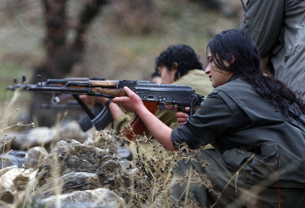 In this picture taken Friday, Dec. 18, 2009, a member of the Free Life Party, or PJAK, trains on a weapon at their camp in the Qandil mountains in northern Iraq