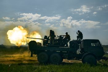 Ukrainian soldiers fire a cannon near Bakhmut, in the Donetsk region, Ukraine.