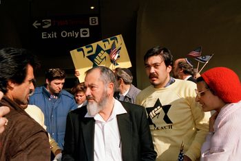 In this October 27, 1988, photo, leader and co-founder of the Jewish Defense League, Brooklyn-born Rabbi Meir Kahane, is joined by supporters shortly after arriving at John F. Kennedy Airport in New York.