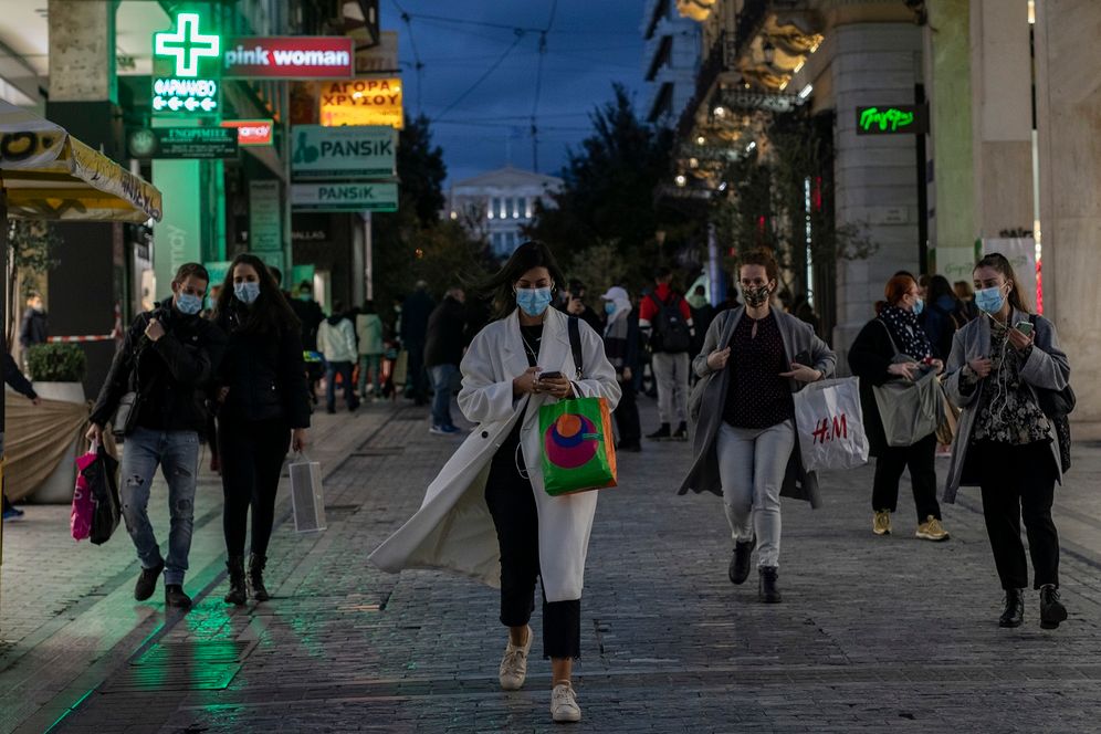 Pedestrians walk in Ermou street, central Athens, one day before the new national lockdown in Greece starts, on November 6, 2020.