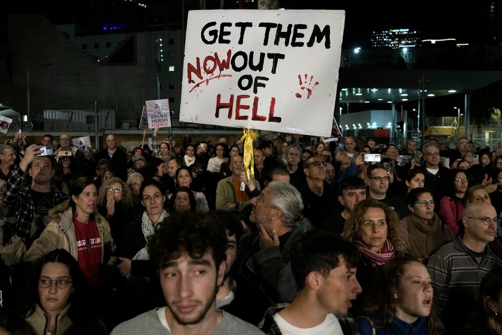A man holds a sign calling for the release of the hostages taken by Hamas to Gaza during the October 7th attack, during a demonstration in Tel Aviv, Israel.