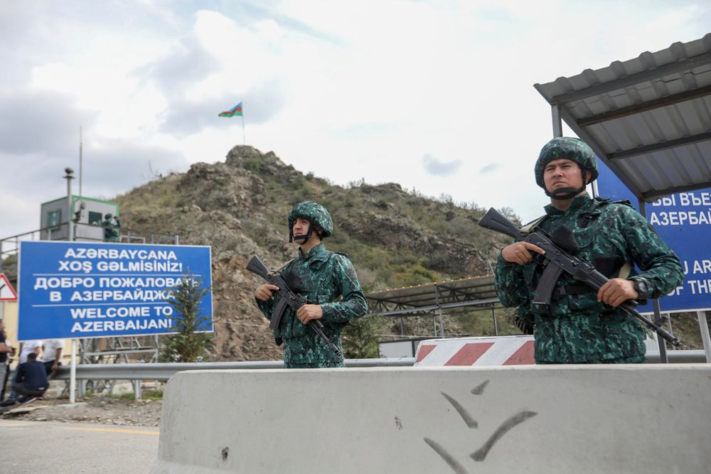 Azerbaijani servicemen guard the Lachin checkpoint in Azerbaijan.