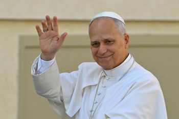 Pope Leo XIV waves to the crowd during the weekly general audience at St Peter's Square in The Vatican on October 29, 2025