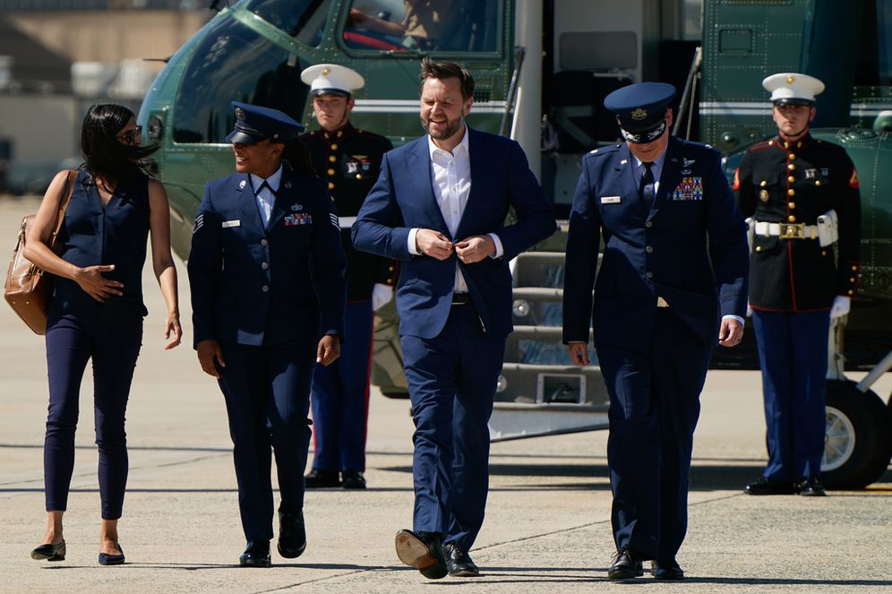 (Elizabeth Frantz/Pool Photo via AP) Vice President JD Vance, center, and second lady Usha Vance, left, walk from Marine Two as they arrive at Joint Base Andrews, Md., Saturday, June 20, 2026, en route to Switzerland.