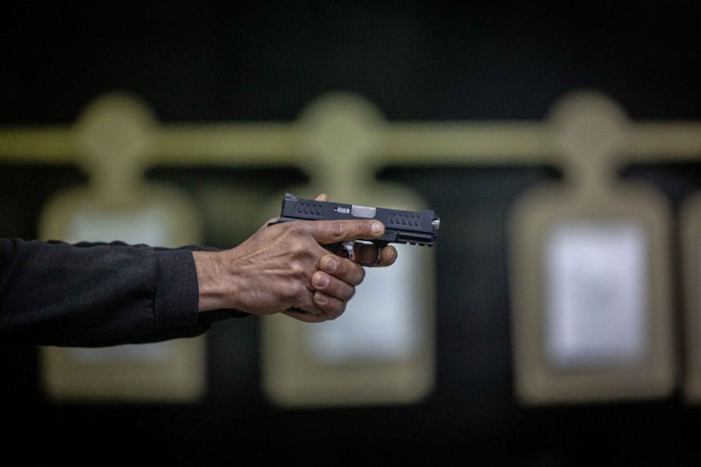 Israelis practice shooting handguns at a Jerusalem shooting range, following the recent wave of terror attacks in Israel, on April 3, 2022.