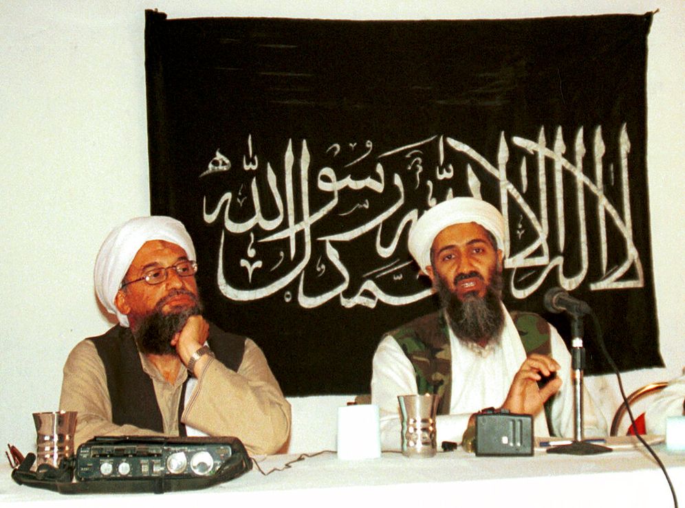 In this 1998 file photo made available on March 19, 2004, Ayman al-Zawahri (L) listens during a news conference with Osama bin Laden in Khost, Afghanistan.