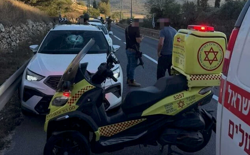 Magen David Adom The scene where an Israeli woman was lightly injured after Palestinians hurled stones at her car on Route 60 Highway, near Sinjil in the West Bank on July 15, 2026