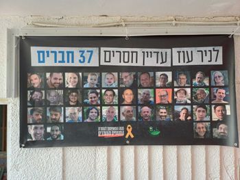 A poster with the 37 members of Kibbutz Nir Oz who are still being held captive in Gaza.