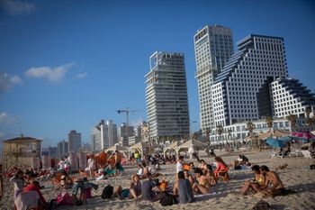 Israelis enjoy the beach in Tel Aviv on May 22, 2021.