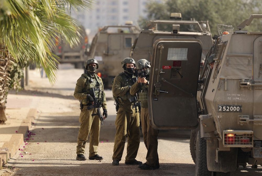 Israeli soldiers keep position during a military operation in the Palestinian town of Silwad, near the city of Ramallah in the West Bank, on August 31, 2022.