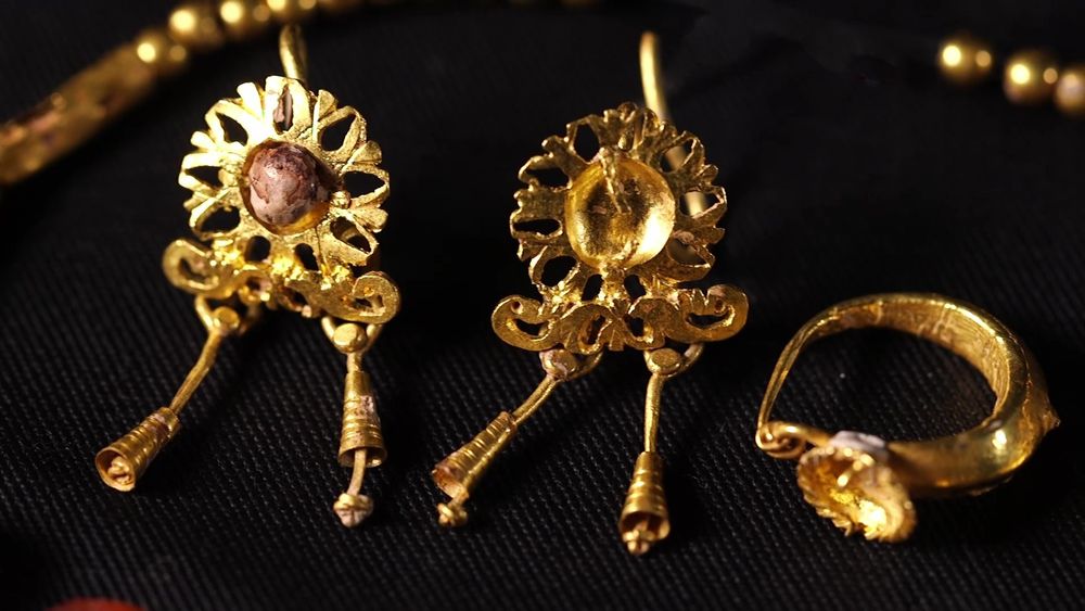 Gold earrings.
