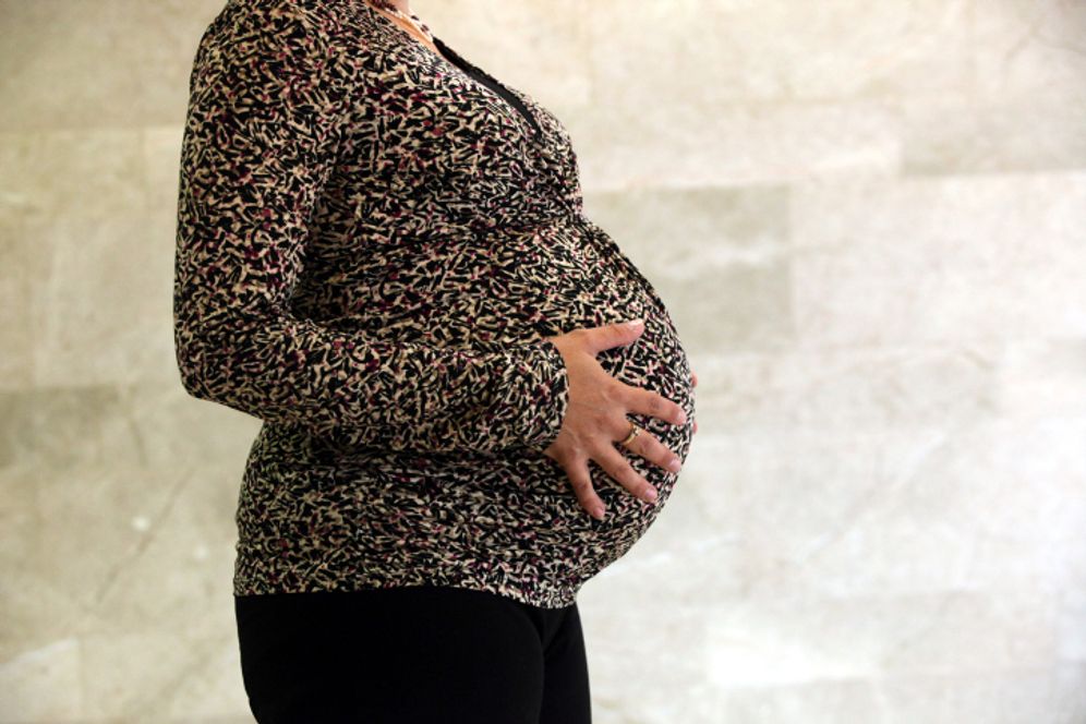 A pregnant woman.