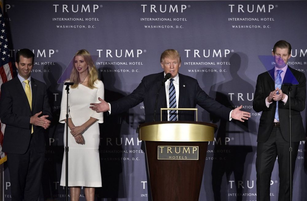 Donald Trump, with children (L-R) Donald Trump Jr., Ivanka Trump, and Eric Trump, speaks during the grand opening of the Trump International Hotel in Washington, DC, United States, on October 26, 2016.