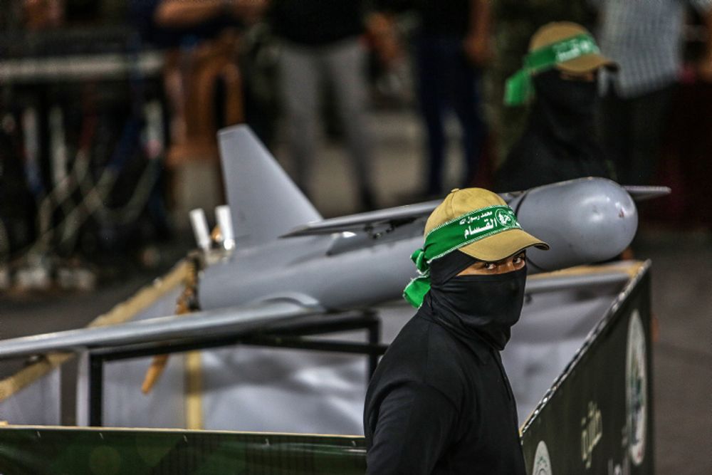 Palestinian members of the armed wing of Hamas next to drones, in the town of Khan Yunis, in the southern Gaza Strip, on July 26, 2022.