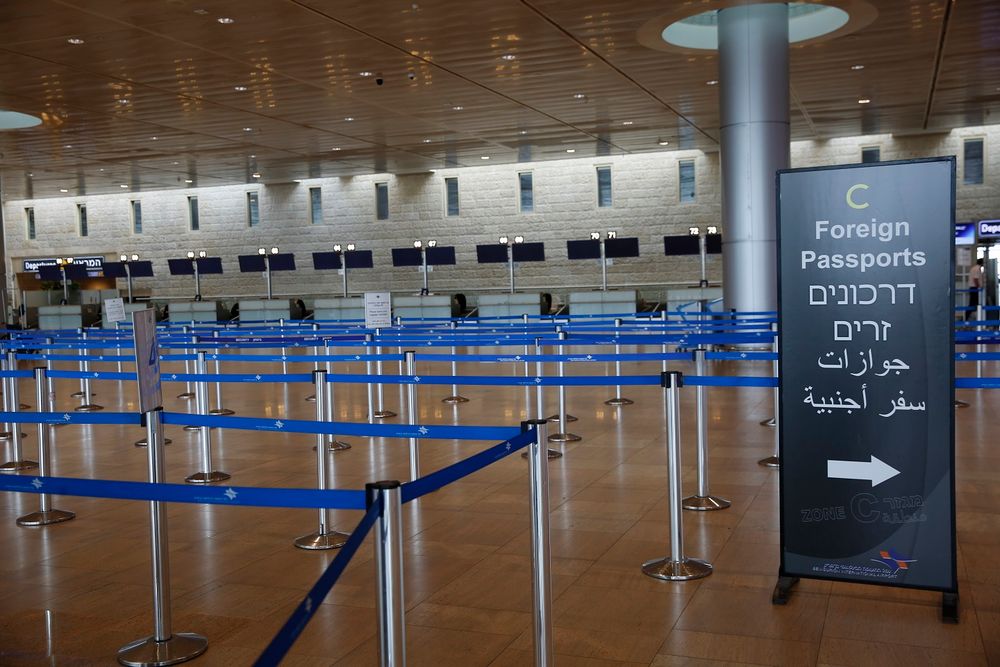 Check-in counters are empty at the Ben Gurion Airport near Tel Aviv, Israel, on March 10, 2020, as restrictions kicked in in the country due to the coronavirus pandemic.