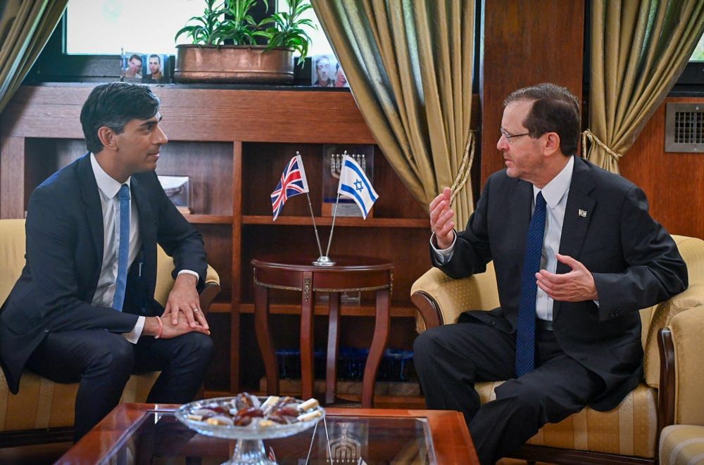 British Prime Minister Rishi Sunak (L) meets with Israeli President Isaac Herzog, in Israel.