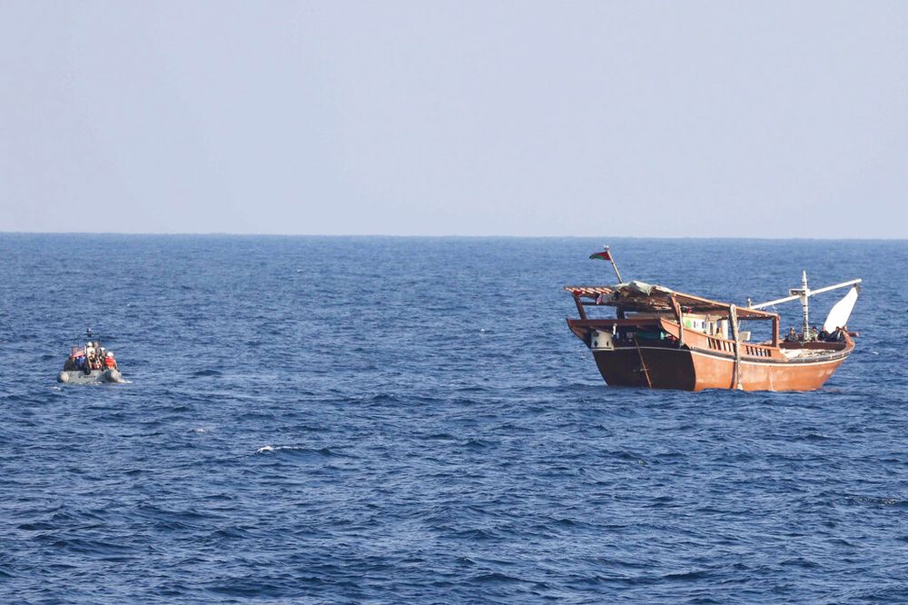 A boarding team from patrol coastal ship USS Chinook approaches a fishing vessel in international waters off the Gulf of Oman.