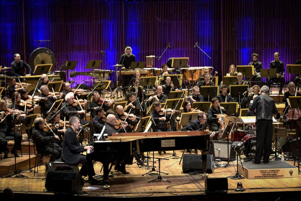 Photo by Yossi Zeliger/Flsah90 Israeli singer and composer Yoni Rechter performs with the Israeli Philharmonic Orchestra at Heichal HaTarbut in Tel Aviv on February 7, 2018