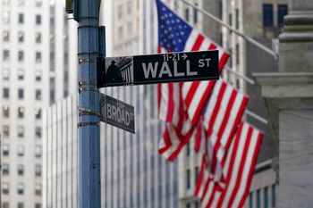 The Wall St. street sign outside the New York Stock exchange, the United States, on January 14, 2022.