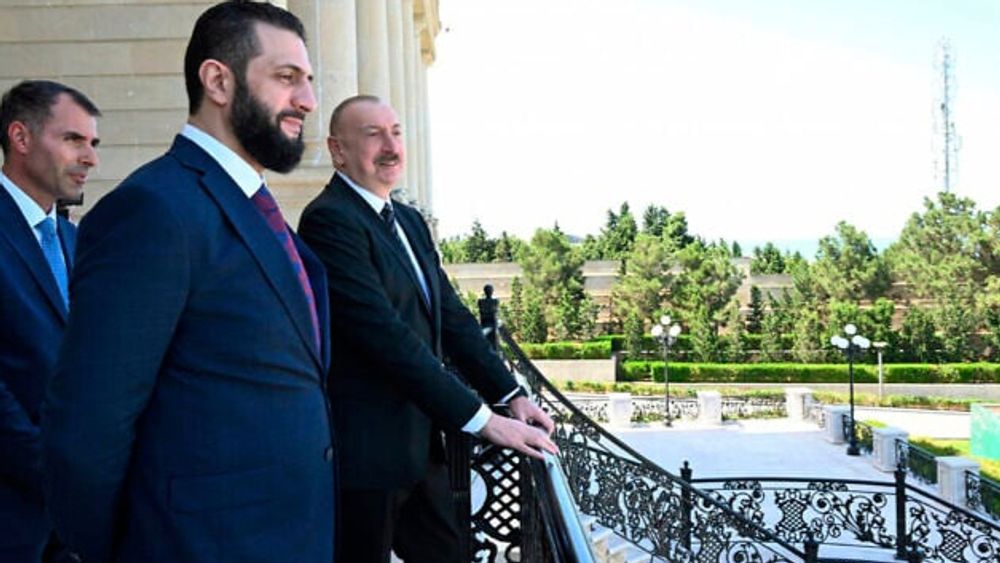 Azerbaijan's Ilham Aliyev (R) and Syria's Ahmad al-Sharaa, during their meeting in Baku, July 12, 2025.