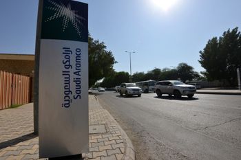 A sign indicates the Saudi Aramco in front of the company's offices in the Saudi capital Ryadh, on December 5, 2019.