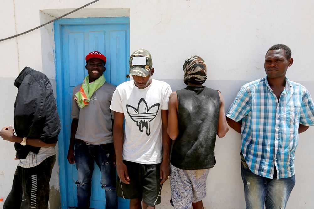 Rescued migrants wait in the port of Ben Gardane, southern Tunisia.