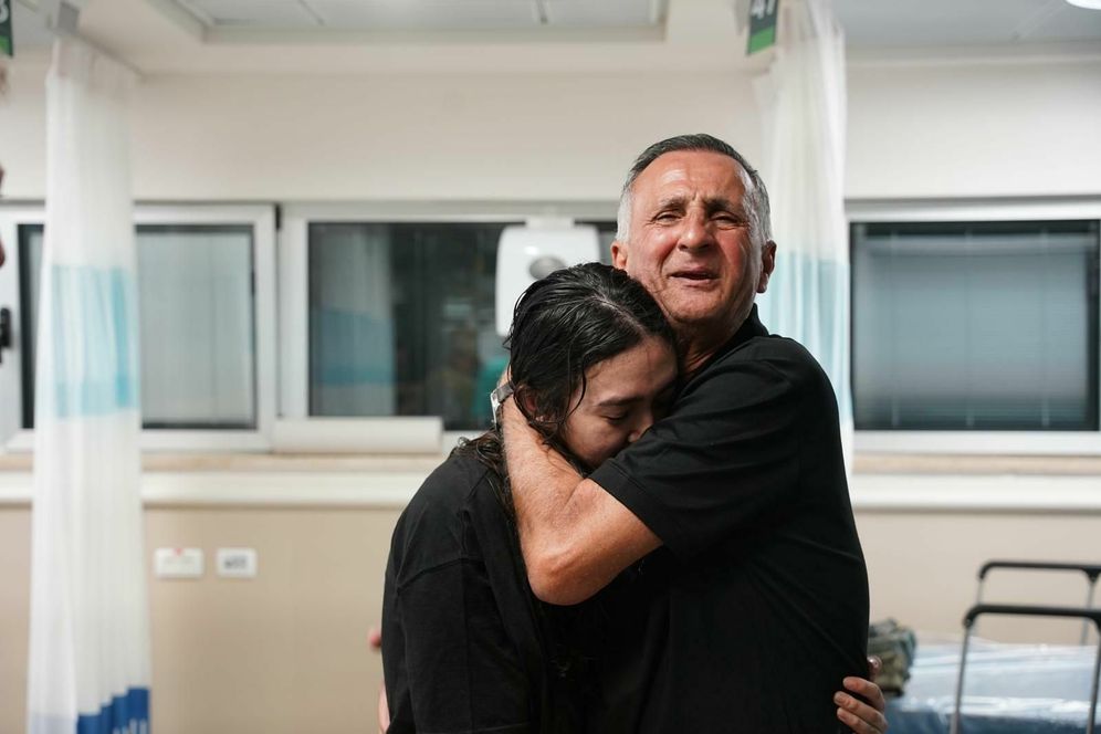 Noa Argamani in her father's embrace after Israeli security forces rescued her from Gaza