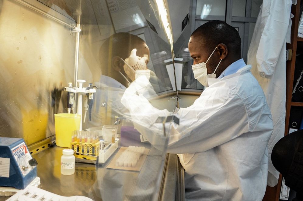 A researcher prepares reagents for testing the samples for the COVID-19 coronavirus at the laboratory of Kenya Medical Research Institute (KEMRI) where they have the capacity to test 384 samples per day in Kisumu, western Kenya, on April 23, 2020.