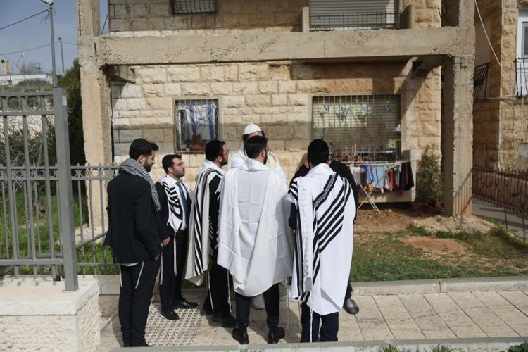 Orthodox Jews at the scene of last nights terror attack, where 7 Israeli were killed, and several more wounded outside a synagogue in the Neve Daniel neighborhood of Jerusalem, January 28, 2023.