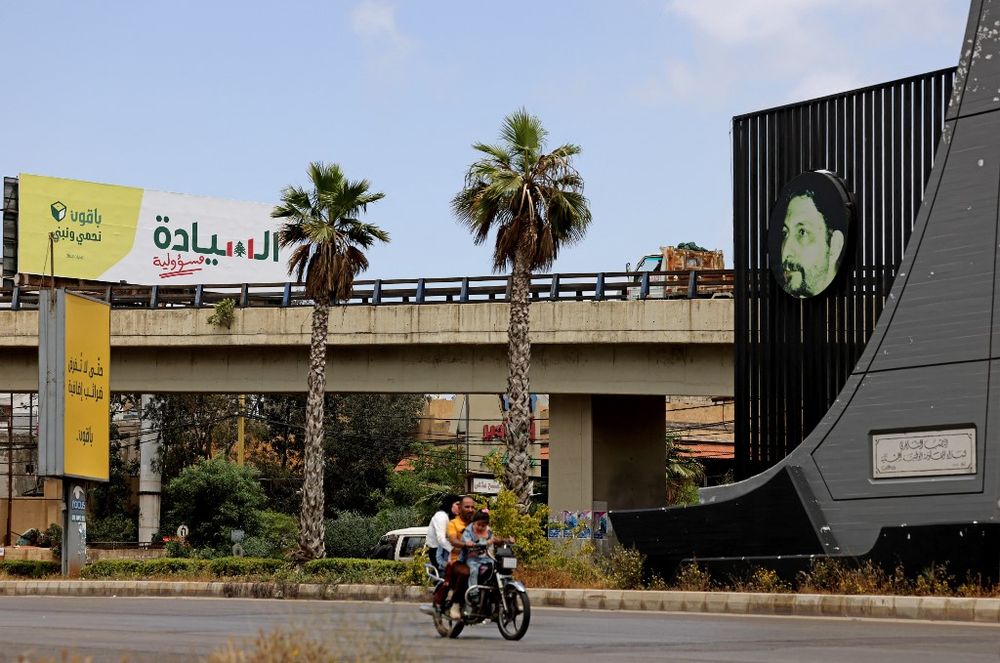 A parliamentary elections campaign billboard for Lebanon's Shiite Hezbollah group hangs on the side of a highway in Beirut on May 5, 2022.