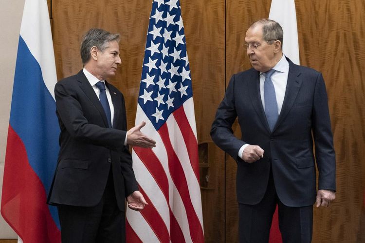 US Secretary of State Antony Blinken, left, greets Russian Foreign Minister Sergey Lavrov before their meeting, in Geneva, Switzerland, January 21, 2022.