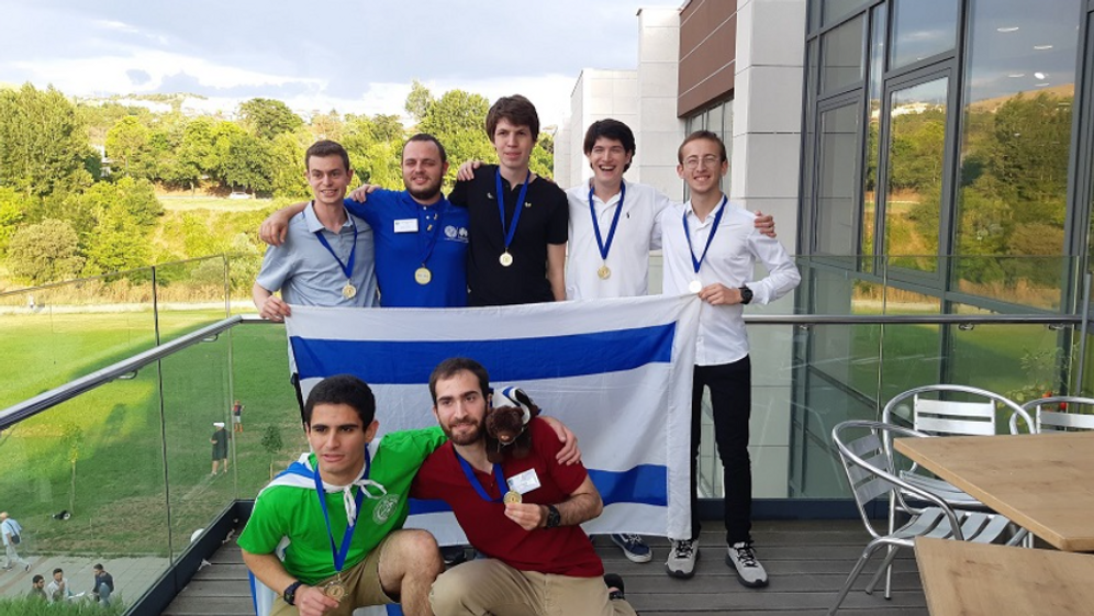The winning team of Tel Aviv University students with its plush mascot.