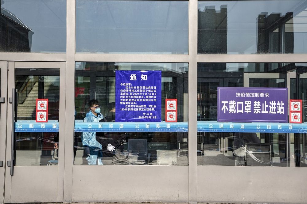 A staff member standing inside the closed Jilin Railway Station in Jilin in China's northeastern Jilin province on May 13, 2020.