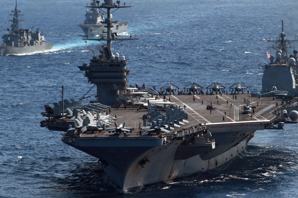 FILE - In this Dec. 10, 2010 file photo, U.S. Navy aircraft carrier USS George Washington and other ships take part in "Keen Sword" U.S.-Japan joint military exercise over the Pacific Ocean