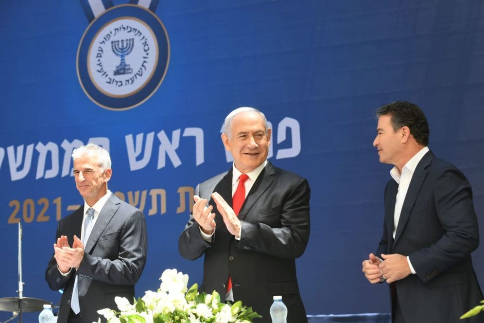 Israel's Prime Minister Benjamin Netanyahu (center) is flanked by outgoing Mossad chief Yossi Cohen (right) and incoming head David Barnea at an award ceremony in Jerusalem on May 24, 2021.