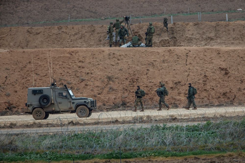 FILE - Israeli soldiers man a position on the Israel Gaza border, overlooking Gaza, during a protest, Friday, Dec. 28, 2018