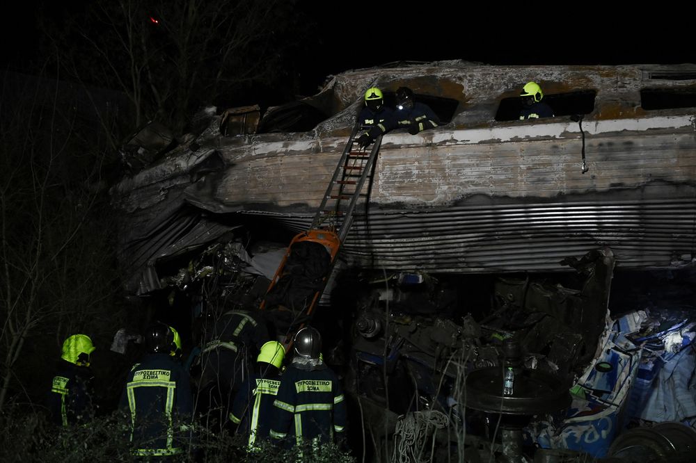 Rescue workers search the wreckage after a train accident near Larisa, Greece