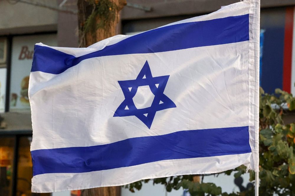 A picture shows an Israeli flag during a rally in the northern Israeli city of Karmiel near Haifa on November 3, 2020.