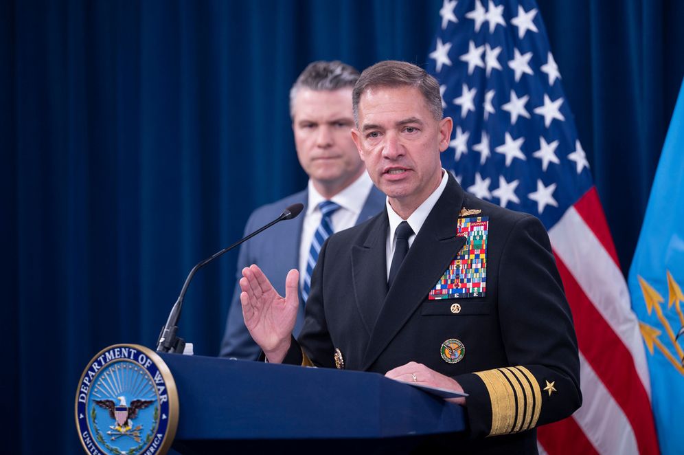 AP Photo/Kevin Wolf Adm. Brad Cooper speaks to members of the media during a press briefing with Defense Secretary Pete Hegseth, left, at the Pentagon, Thursday, April 16, 2026 in Washington