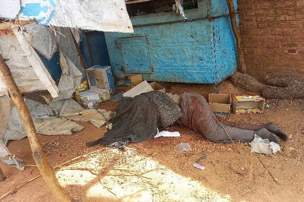 A covered body outside a house in the West Darfur state capital El Geneina, amid ongoing fighting between two generals in war-torn Sudan.
