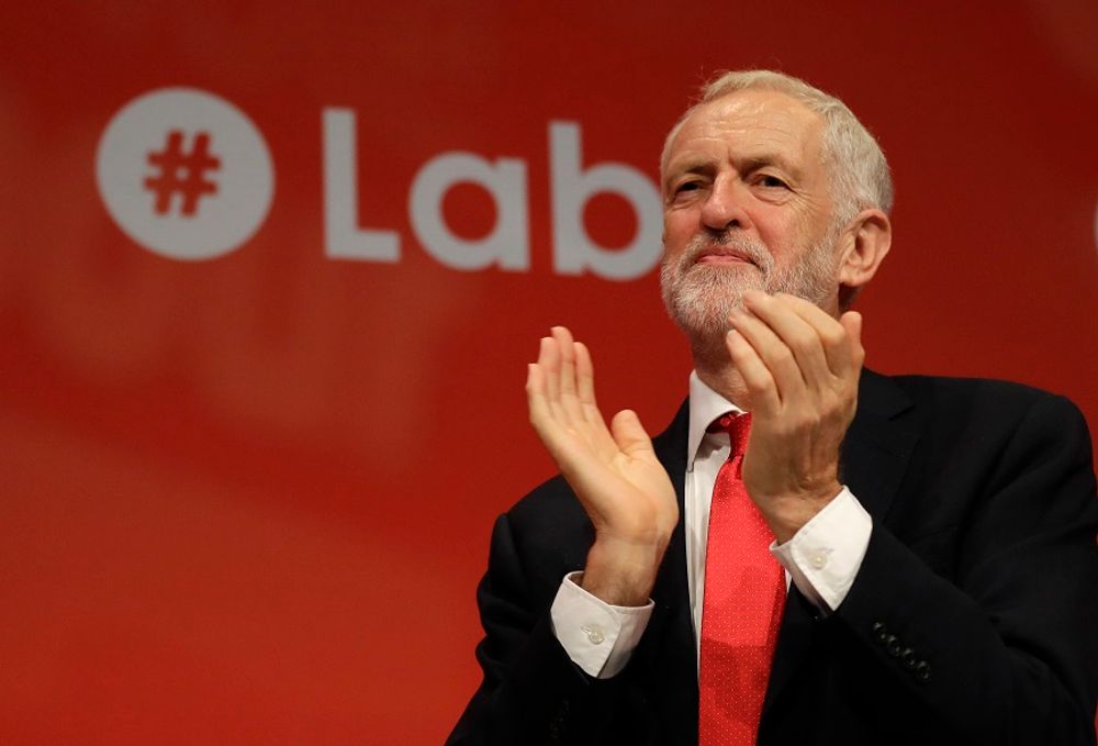 Jeremy Corbyn, Leader of Britain's opposition Labour Party applauds during the Labour Party Conference at the Brighton Center in Brighton, England, Sunday, Sept. 22, 2019
