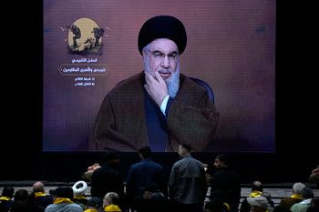 Hezbollah leader Hassan Nasrallah speaks via a video link during a rally in Beirut, Lebanon