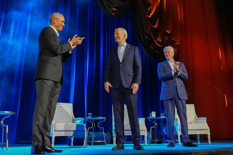 President Joe Biden, center, and former presidents Barack Obama, left, and Bill Clinton, right, participate in a fundraising event at Radio City Music Hall, March 28, 2024, in New York.
