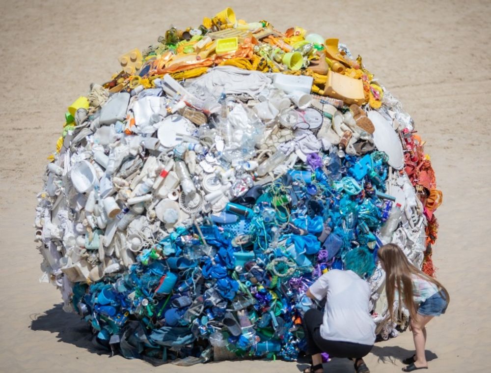 Giant Plastic Ball Sends Tel Aviv Beachgoers An Urgent Message i24NEWS