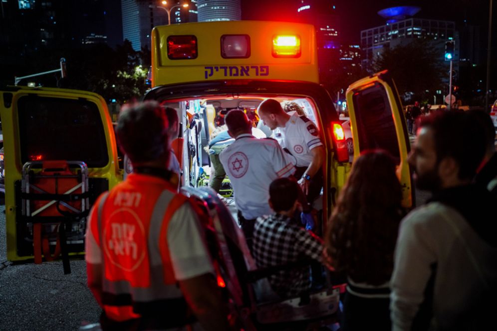 Emergency services respond after protesters are hit by a vehicle in Tel Aviv, April 2024
