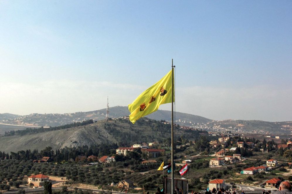 A Hezbollah flag on a hill facing the Israeli northern town of Metula by the border with Lebanon, on January 3, 2021.