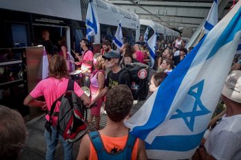 Activists protest against the decision to not operate the new Metropolitan Light Rail on Shabbat, Tel Aviv, August 18, 2023.