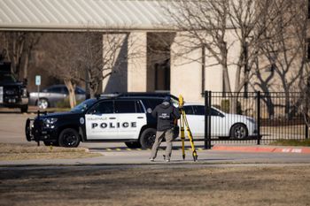 Law enforcement process the scene in front of the Congregation Beth Israel synagogue, January 16, 2022, in Colleyville, Texas.