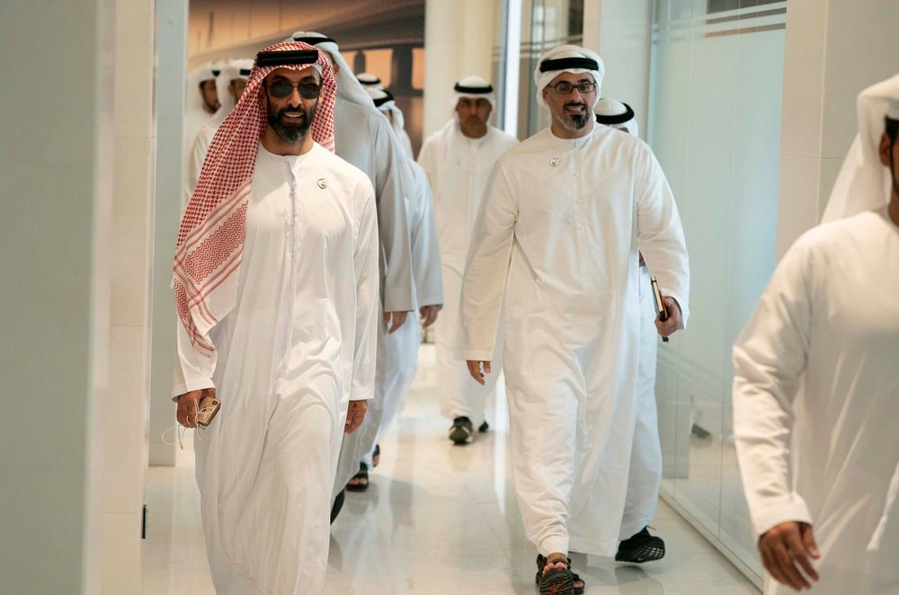 Sheikh Tahnoun bin Zayed Al Nahyan (L) walks to a meeting in Abu Dhabi, United Arab Emirates.