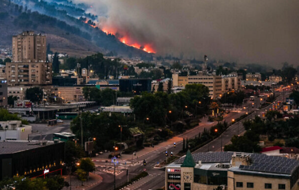 View of a large fire caused by rockets fired from Lebanon in the town of Kiryat Shmona, June 3, 2024